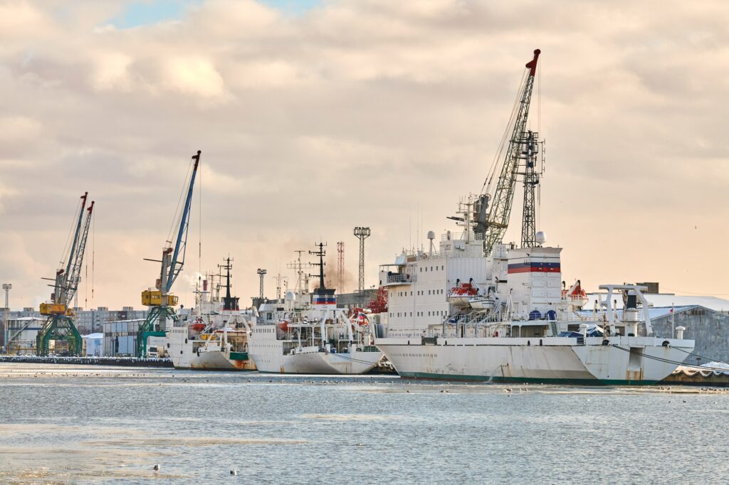 Moored ships and harbor cranes in port